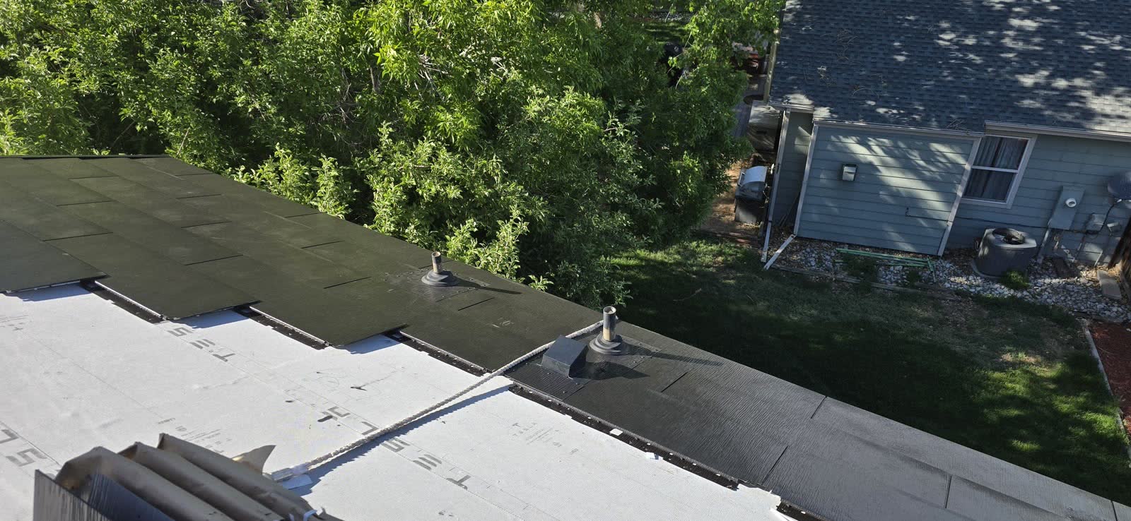 Tesla Solar Roof post-hail rebuild — Beacon Point Aurora CO